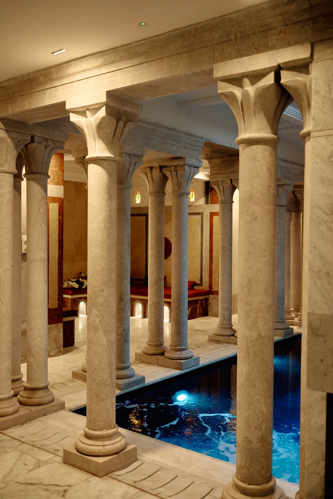 A marble colonnade bordering the covered pool.